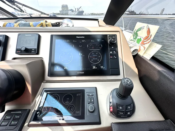 Grand Cru Yacht Photos Pics Cockpit of 2017 Prestige 500 S yacht with navigation screens and controls.