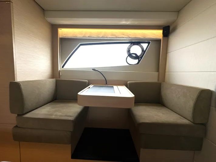 Grand Cru Yacht Photos Pics Interior of 2017 Prestige 500 S yacht with cozy seating and table.