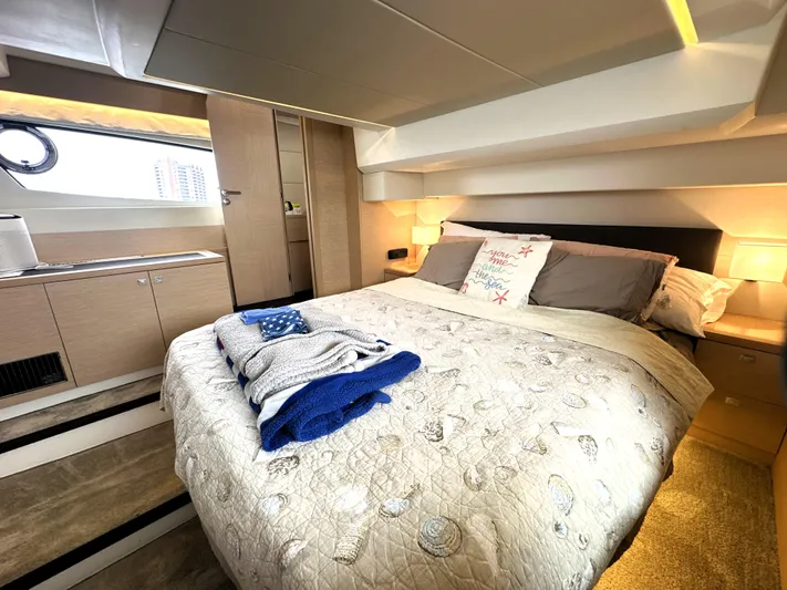Grand Cru Yacht Photos Pics Luxurious bedroom interior of 2017 Prestige 500 S yacht with cozy bedding and modern design.