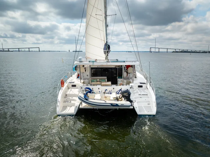 Walkabout Yacht Photos Pics 2019 Royal Cape Catamarans Majestic 530 sailing on open water under cloudy skies.