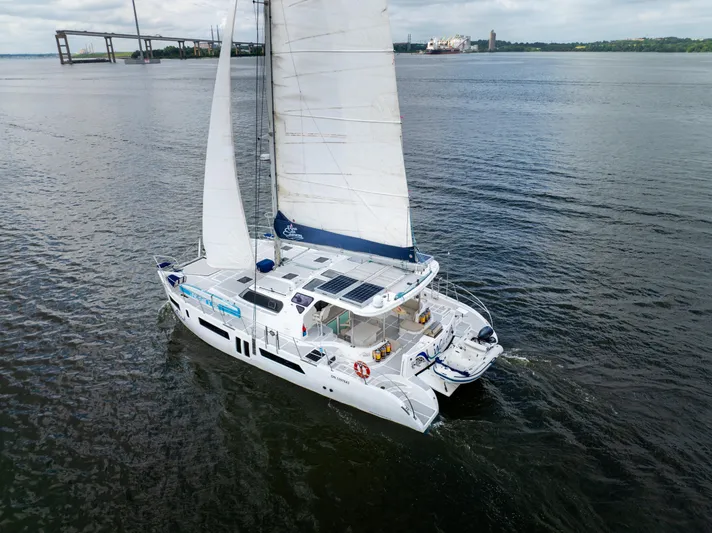 Walkabout Yacht Photos Pics 2019 Royal Cape Catamarans Majestic 530 sailing on open water, showcasing sleek design and spacious deck.