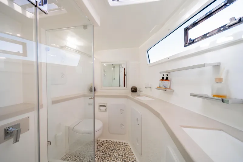 Walkabout Yacht Photos Pics Luxurious bathroom in 2019 Royal Cape Catamarans Majestic 530, featuring modern fixtures and elegant design.
