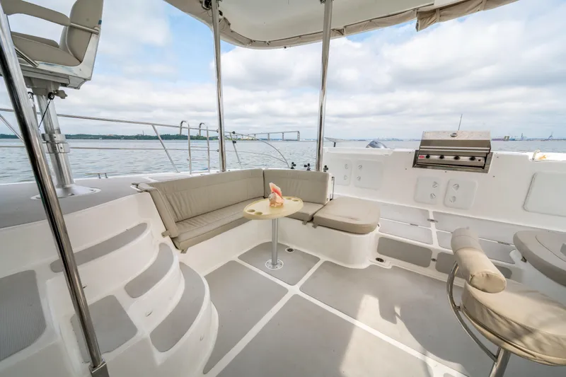 Walkabout Yacht Photos Pics Luxurious 2019 Royal Cape Catamarans Majestic 530 deck with seating and ocean view.