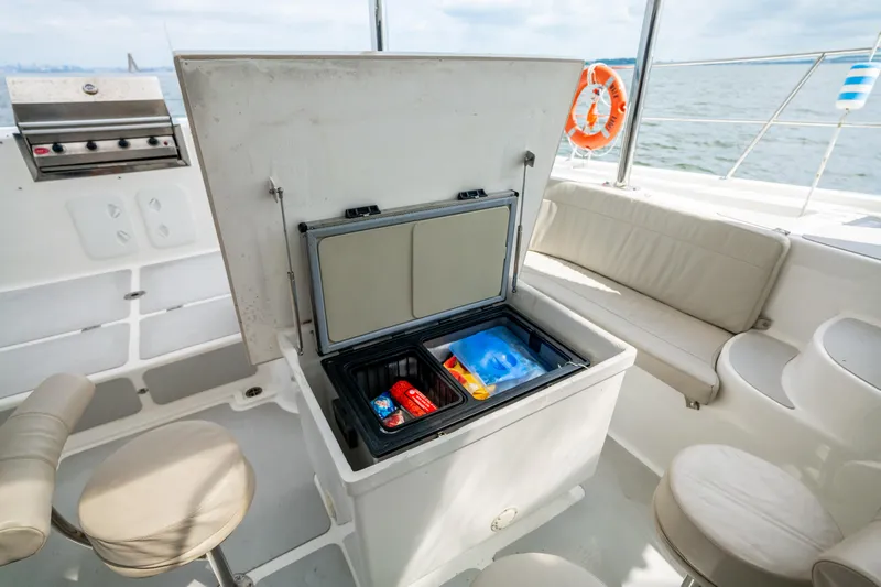 Walkabout Yacht Photos Pics Outdoor seating and cooler on 2019 Royal Cape Catamarans Majestic 530 yacht deck.