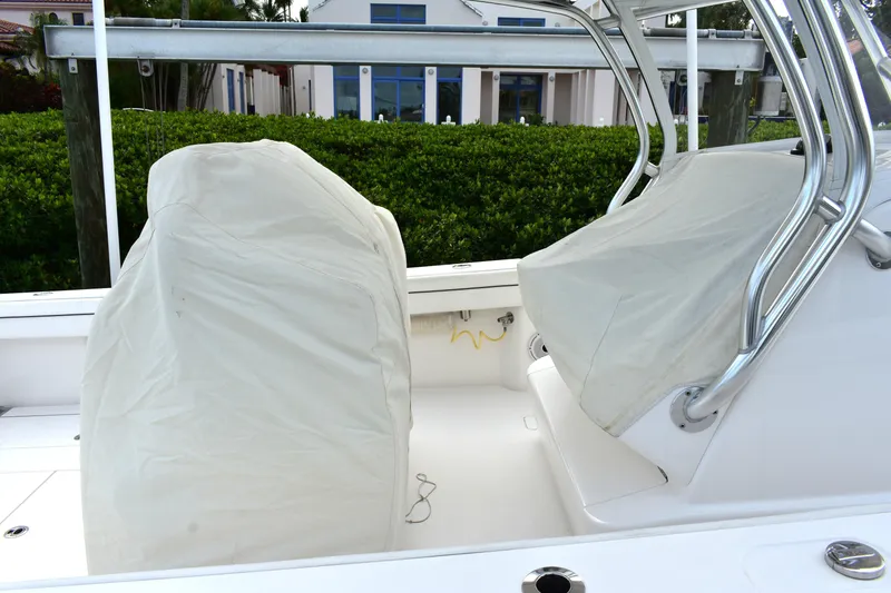 Low Key Yacht Photos Pics 2021 Valhalla V-33 boat with covered seats and stainless steel frame.