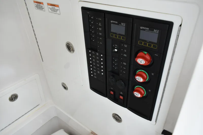 Low Key Yacht Photos Pics Electrical control panel on 2021 Valhalla V-33 boat, featuring switches and gauges.