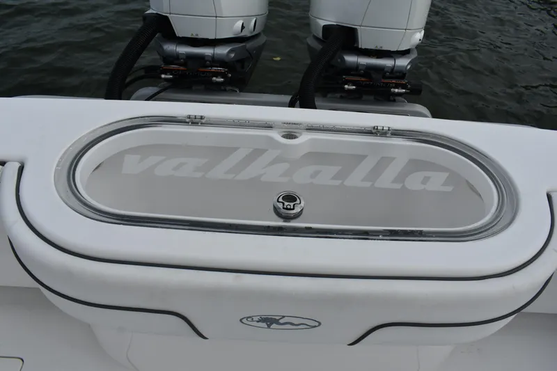 Low Key Yacht Photos Pics Valhalla V-33 2021 boat with dual engines and branded livewell on water.