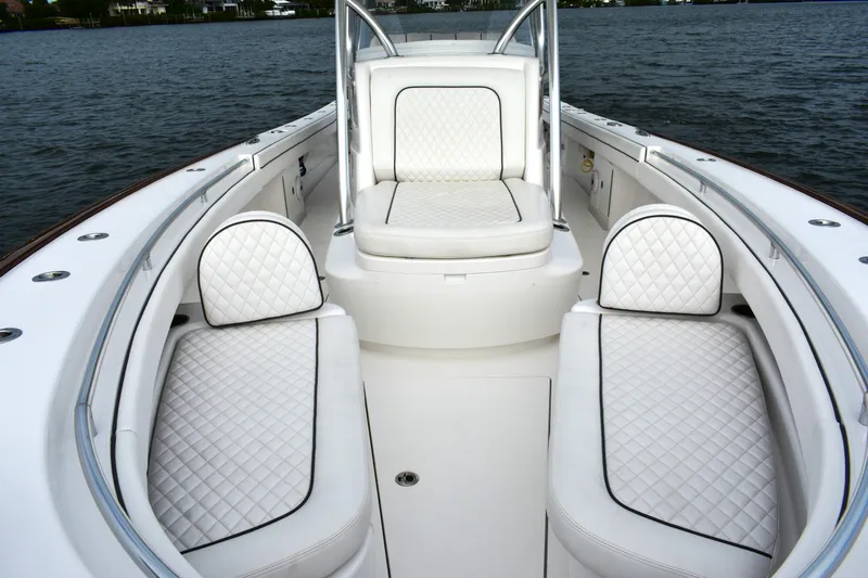 Low Key Yacht Photos Pics Luxurious 2021 Valhalla V-33 boat interior with white quilted seating.