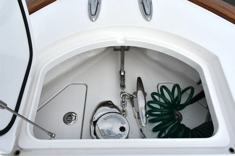 Low Key Yacht Photos Pics Anchor compartment of 2021 Valhalla V-33 boat with chain and hose.