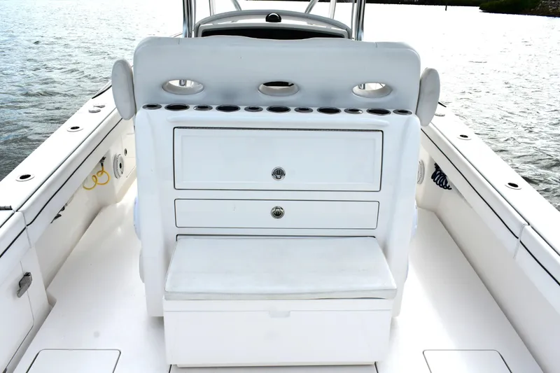 Low Key Yacht Photos Pics 2021 Valhalla V-33 boat interior with storage drawers and seating on the water.