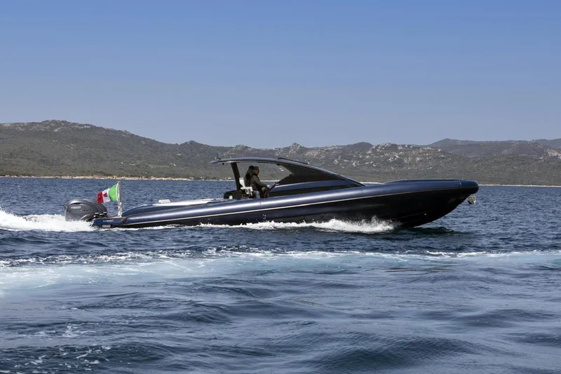 Granturismo 14.0 X Yacht Photos Pics 2024 Lomac GranTurismo 14.0 cruising on open water with scenic mountain backdrop.