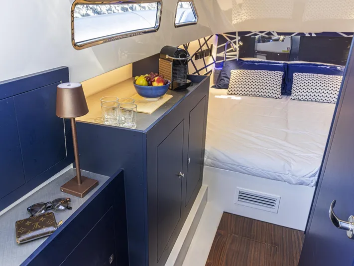 Granturismo 14.0 X Yacht Photos Pics 2024 Lomac GranTurismo 14.0 cabin interior with bed, fruit bowl, and coffee maker.