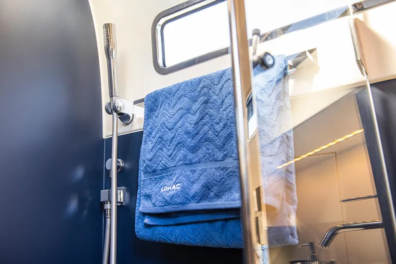 Granturismo 14.0 X Yacht Photos Pics 2024 Lomac GranTurismo 14.0 bathroom with blue towel and modern shower fixtures.