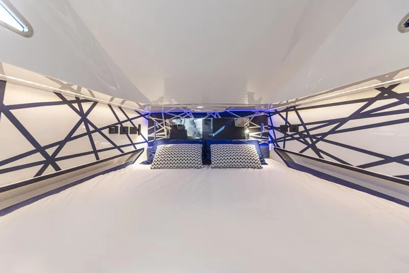 Granturismo 14.0 X Yacht Photos Pics 2024 Lomac GranTurismo 14.0 cabin interior with modern geometric design and cozy bedding.