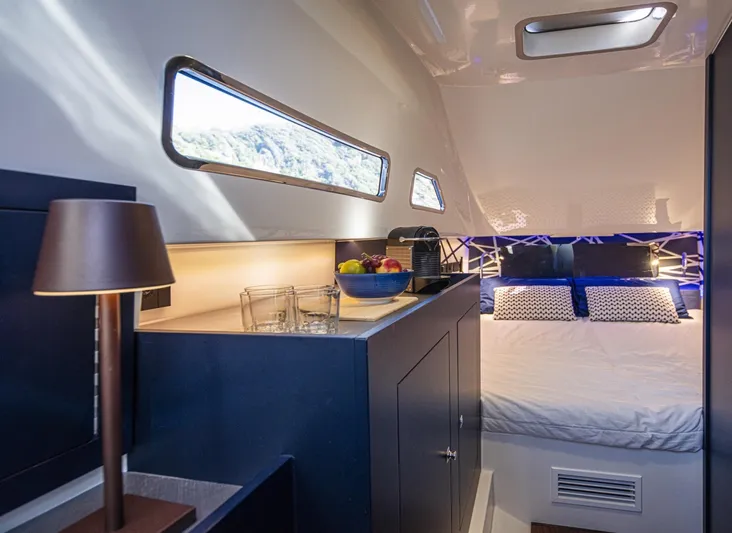 Granturismo 14.0 X Yacht Photos Pics Luxurious cabin interior of 2024 Lomac GranTurismo 14.0 with modern amenities and cozy bedding.