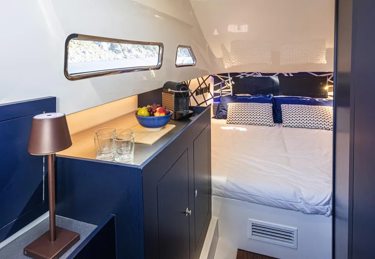 Granturismo 14.0 X Yacht Photos Pics 2024 Lomac GranTurismo 14.0 cabin interior with bed, fruit bowl, and modern decor.