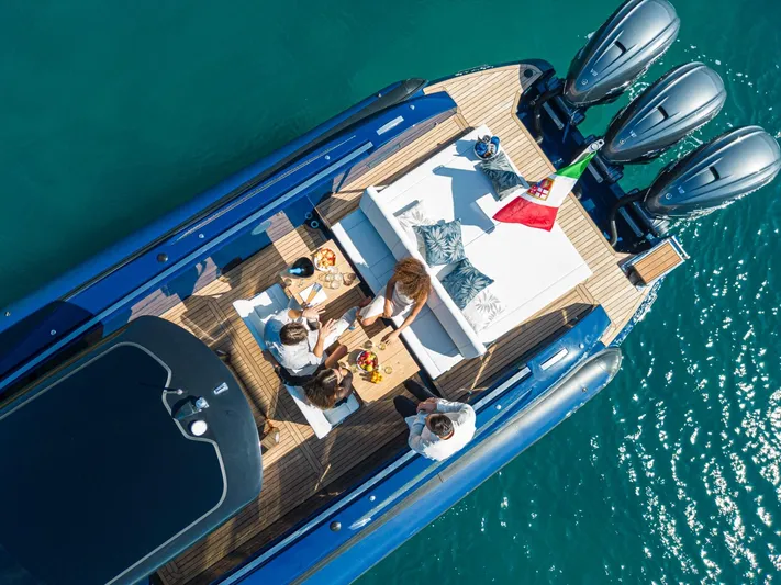 Granturismo 14.0 X Yacht Photos Pics 2024 Lomac GranTurismo 14.0 yacht with people enjoying a meal on deck.