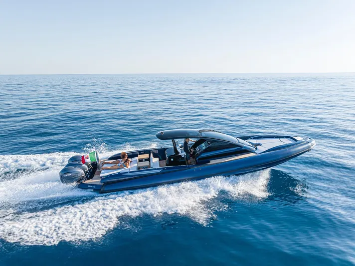 Granturismo 14.0 X Yacht Photos Pics 2024 Lomac GranTurismo 14.0 cruising on open sea, showcasing sleek design and performance.