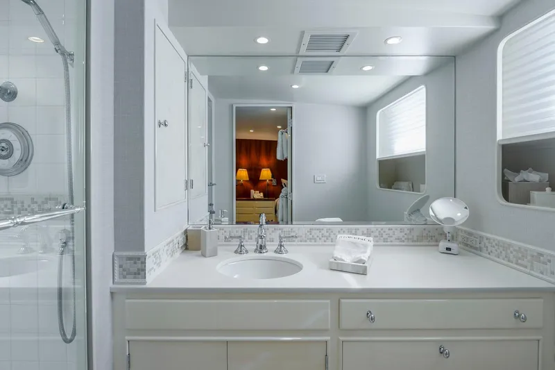 Stoneface Yacht Photos Pics Luxurious bathroom in a 1978 custom Burger yacht, featuring elegant fixtures and spacious design.