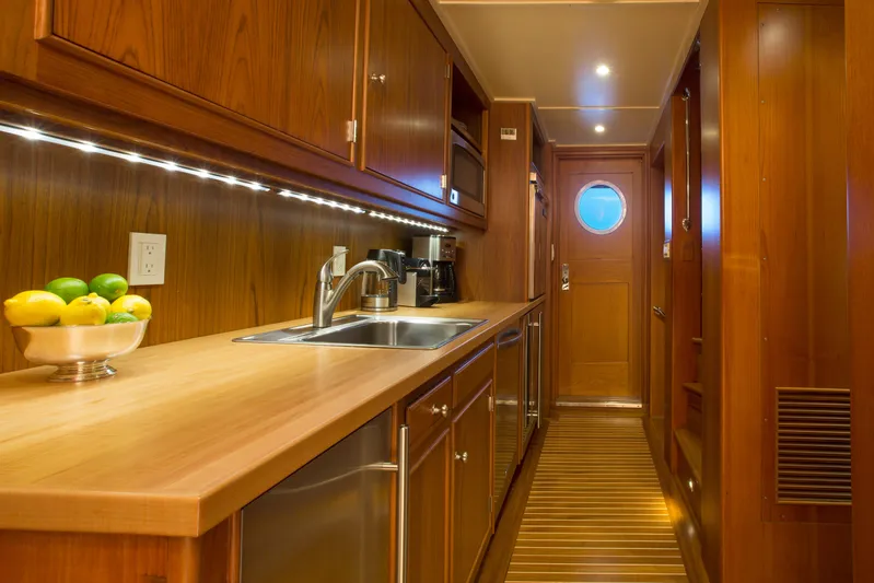 Stoneface Yacht Photos Pics Luxurious wooden yacht kitchen interior with modern appliances, 1978 Burger model.