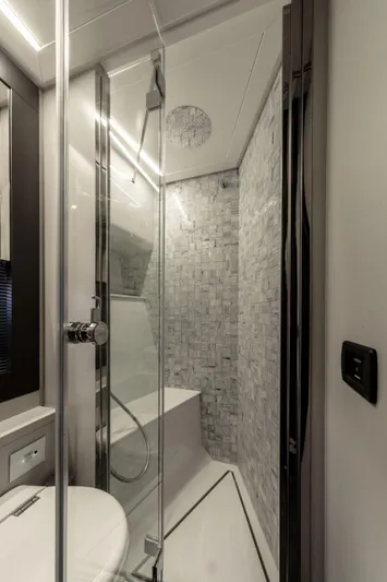 Good Vibes Yacht Photos Pics Luxurious bathroom in 2020 Pershing 62' yacht with modern shower and sleek design.