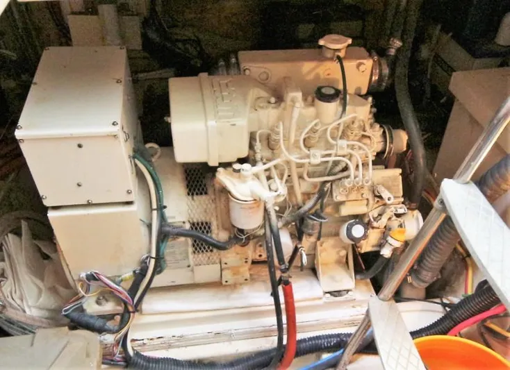 Burgoo Yacht Photos Pics Engine room of 1980 Gulfstar 47 Sailmaster, featuring a well-maintained marine engine.