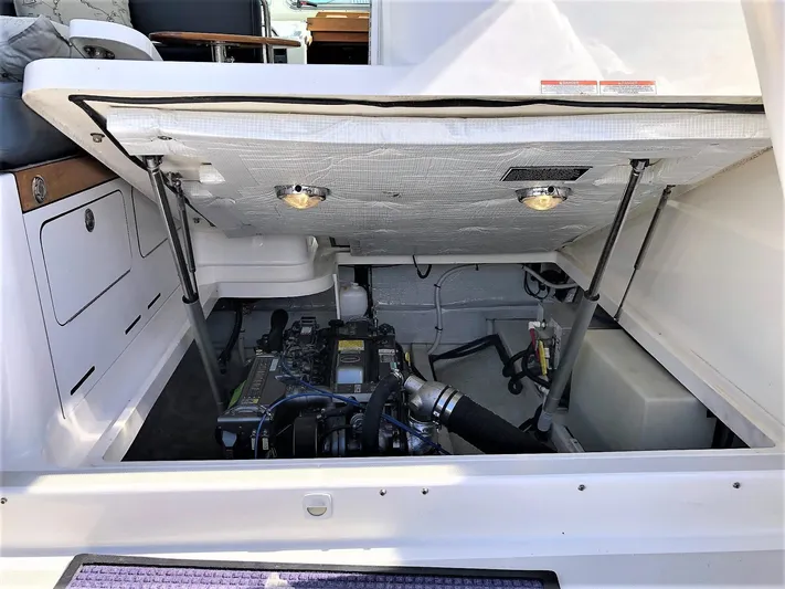 Lady In Blue Yacht Photos Pics Engine compartment of a 2012 Back Cove 30 boat, showcasing mechanical components.