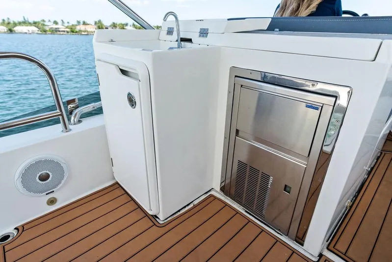 Sea Whisperer Yacht Photos Pics Galeon 500 Fly 2019 yacht deck with built-in appliances and teak flooring.