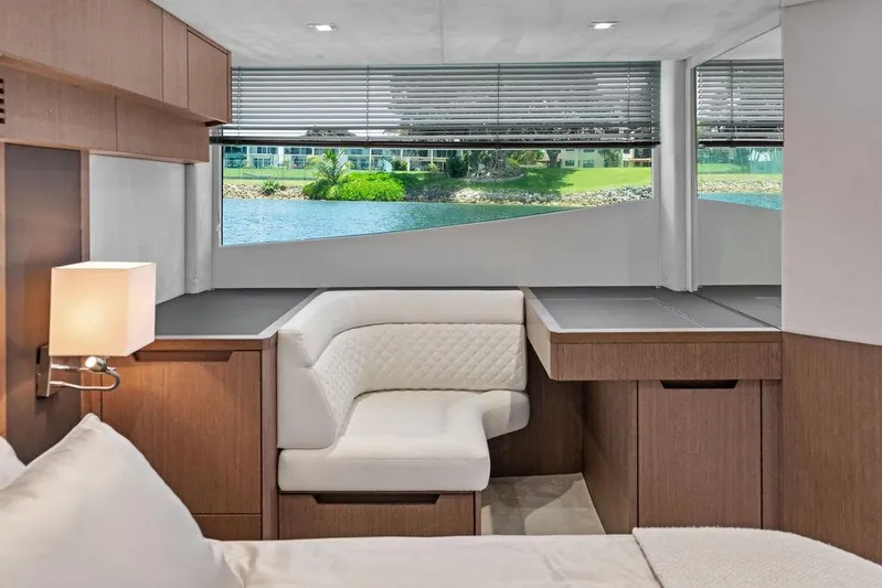 Sea Whisperer Yacht Photos Pics Luxurious interior of 2019 Galeon 500 Fly yacht with elegant seating and scenic window view.