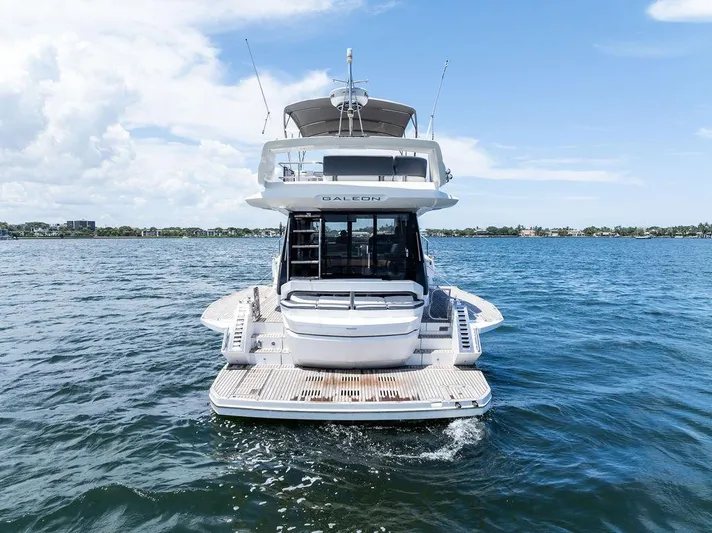 Sea Whisperer Yacht Photos Pics 2019 Galeon 500 Fly yacht on open water, rear view, clear sky.