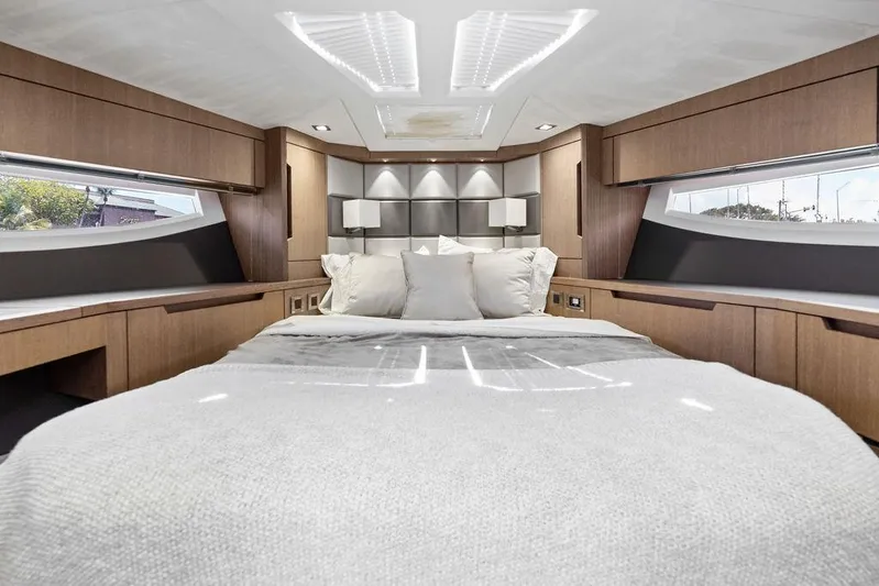 Sea Whisperer Yacht Photos Pics Luxurious bedroom interior of 2019 Galeon 500 Fly yacht with modern design and cozy bedding.