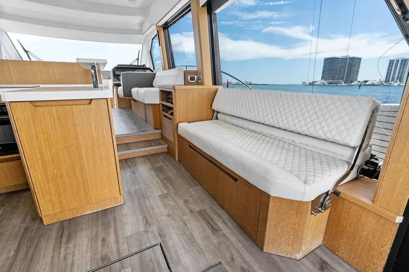 Sea Whisperer Yacht Photos Pics Interior of 2019 Galeon 500 Fly yacht with modern seating and ocean view.
