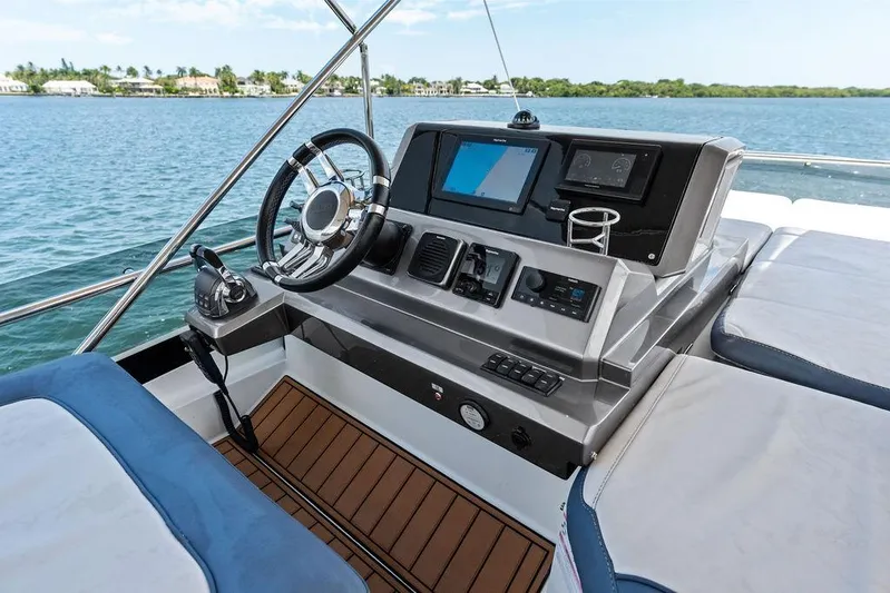 Sea Whisperer Yacht Photos Pics 2019 Galeon 500 Fly yacht helm with modern controls and scenic water view.