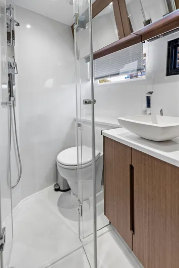 Sea Whisperer Yacht Photos Pics Modern bathroom interior on 2019 Galeon 500 Fly yacht, featuring sleek design and fixtures.
