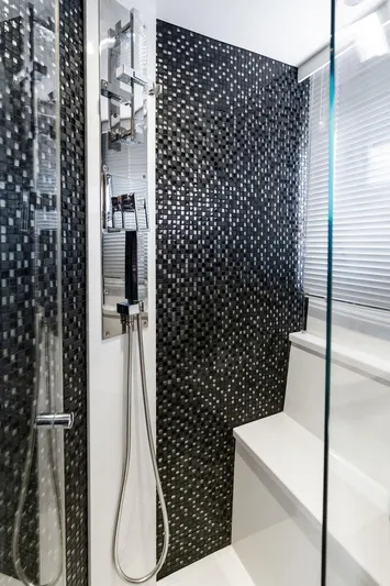 Sea Whisperer Yacht Photos Pics Luxurious bathroom in 2019 Galeon 500 Fly yacht with modern shower and mosaic tiles.