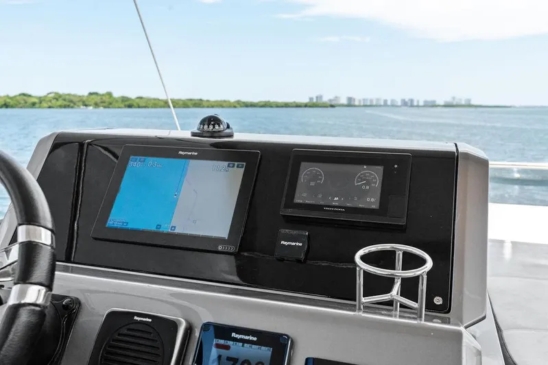 Sea Whisperer Yacht Photos Pics Helm of 2019 Galeon 500 Fly yacht with navigation screens and ocean view.