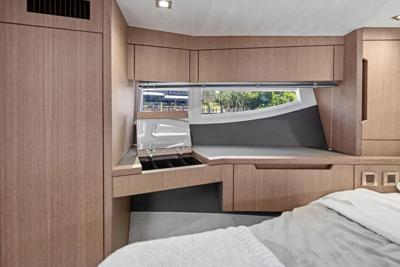 Sea Whisperer Yacht Photos Pics Luxurious interior of 2019 Galeon 500 Fly yacht with modern wood finish and window view.