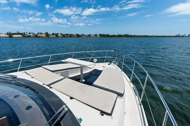 Sea Whisperer Yacht Photos Pics 2019 Galeon 500 Fly yacht deck with sun loungers on open water.