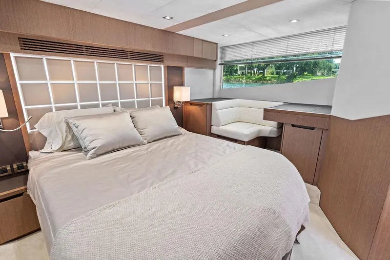 Sea Whisperer Yacht Photos Pics Luxurious bedroom interior of 2019 Galeon 500 Fly yacht with modern design and large window.