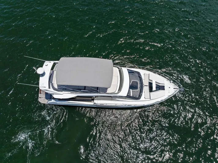 Sea Whisperer Yacht Photos Pics Aerial view of 2019 Galeon 500 Fly yacht cruising on open water.