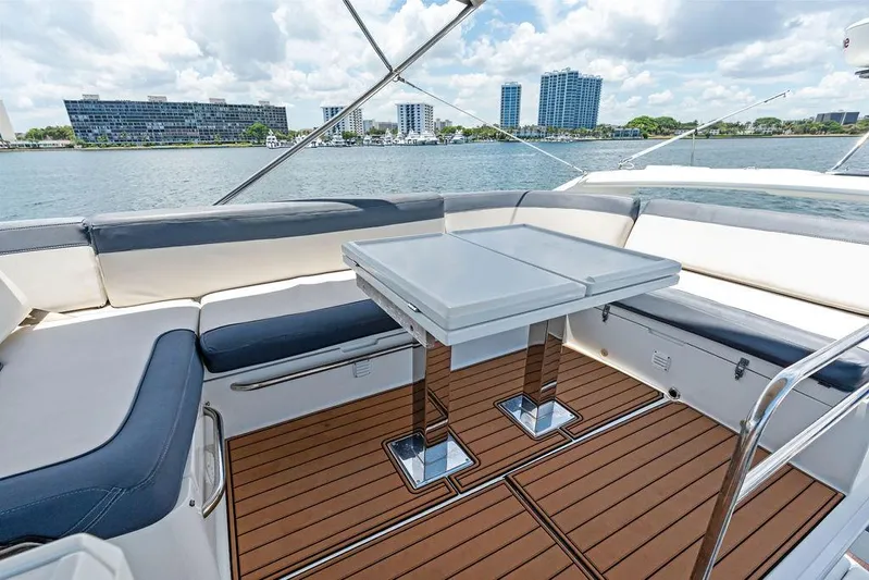 Sea Whisperer Yacht Photos Pics Luxurious seating area on 2019 Galeon 500 Fly yacht with waterfront view.