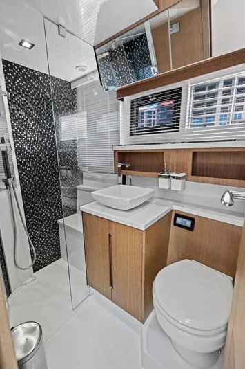 Sea Whisperer Yacht Photos Pics Luxurious bathroom in 2019 Galeon 500 Fly yacht with modern fixtures and elegant design.