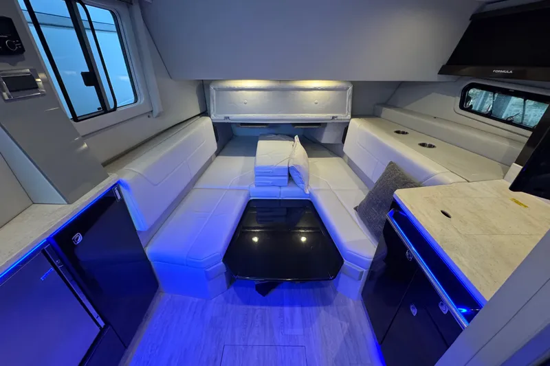 Sea Winds Yacht Photos Pics Luxurious interior of 2020 Formula 400 Super Sport Crossover boat with modern seating and lighting.