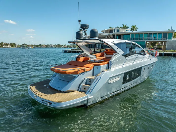 Namaste Yacht Photos Pics 2021 Cranchi M44 yacht docked in sunny waterfront setting.