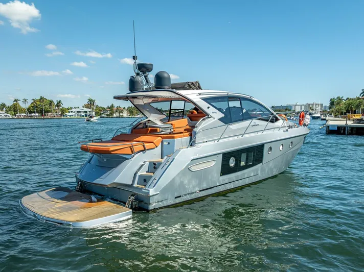 Namaste Yacht Photos Pics 2021 Cranchi M44 yacht on water, sleek design, sunny day, luxury boating experience.