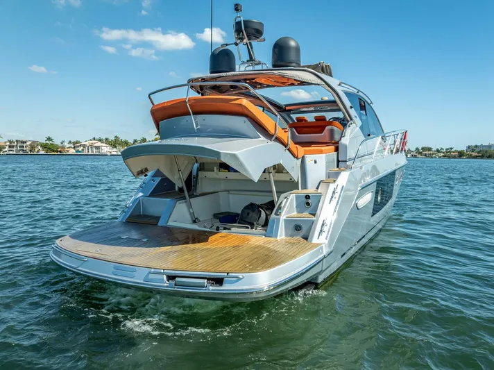 Namaste Yacht Photos Pics 2021 Cranchi M44 yacht on water, showcasing sleek design and spacious deck.