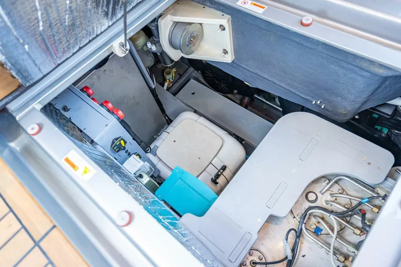 Namaste Yacht Photos Pics Engine compartment of 2021 Cranchi M44 yacht, showcasing mechanical components and wiring.