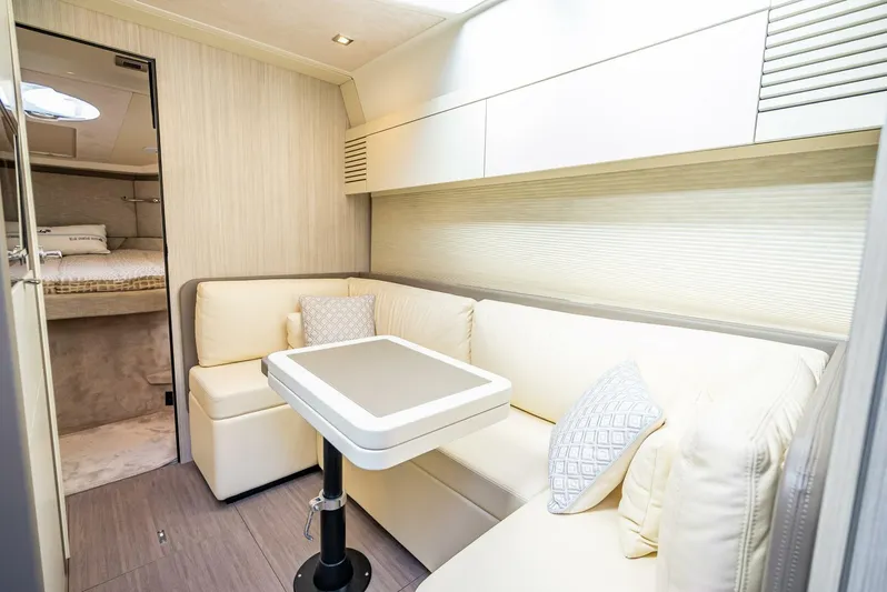 Namaste Yacht Photos Pics Luxurious interior of 2021 Cranchi M44 yacht with elegant seating and modern design.