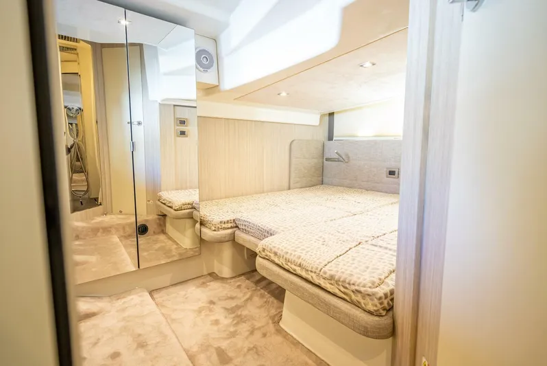 Namaste Yacht Photos Pics Luxurious interior cabin of 2021 Cranchi M44 yacht with modern design and comfortable bedding.