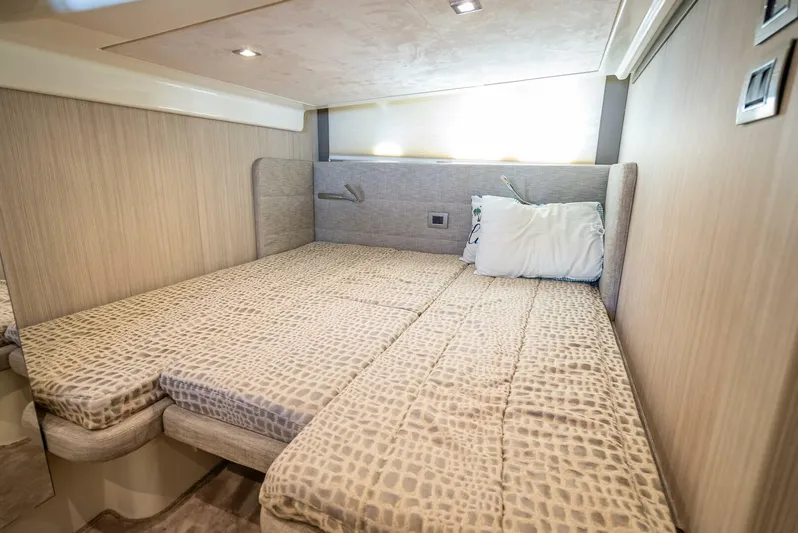 Namaste Yacht Photos Pics Interior cabin of 2021 Cranchi M44 yacht with twin beds and modern decor.